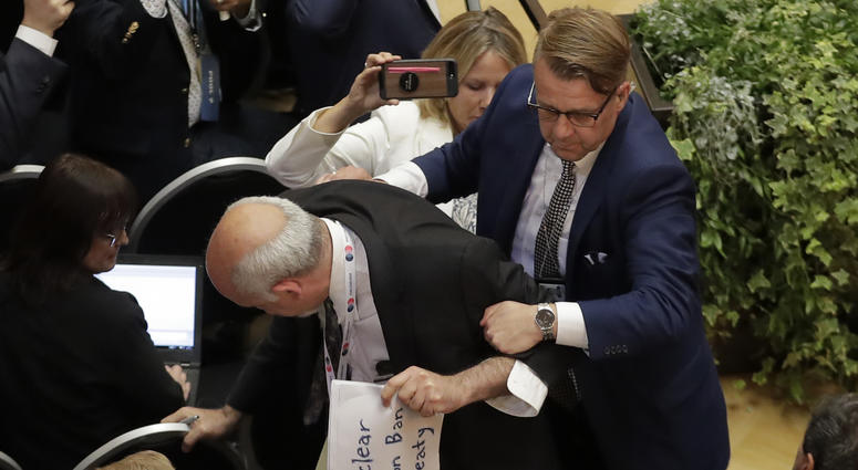 Apparent protester removed ahead of Trump-Putin conference Apparent protester removed ahead of Trump-Putin conference
