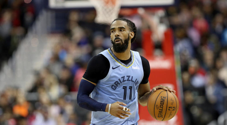 Mike Conley Mike Conley of the Memphis Grizzlies dribbles the ball in a game against the Wizards.