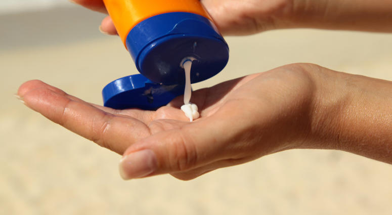 sunscreen Woman holding sunscream