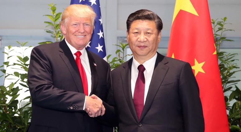 Chinese President Xi Jinping (R) meets with his U.S. counterpart Donald Trump Chinese President Xi Jinping (R) meets with his U.S. counterpart Donald Trump