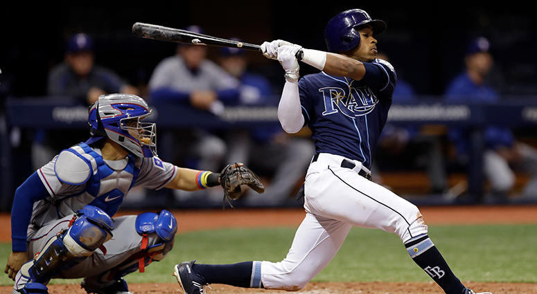 AP - Rangers vs Rays Tampa Bay Rays' Mallex Smith singles off Texas Rangers relief pitcher Jesse Chavez during the fifth inning of a baseball game Monday, April 16, 2018, in St. Petersburg, Fla. Catching for the Rangers is Robinson Chirinos.