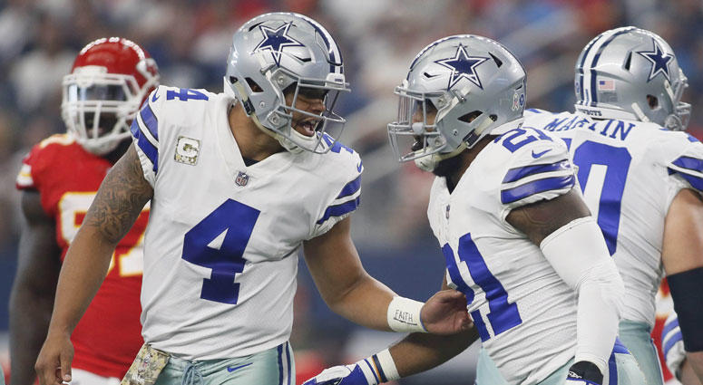 Dallas Cowboys quarterback Dak Prescott (4) tells running back Ezekiel Elliott Dallas Cowboys quarterback Dak Prescott (4) tells running back Ezekiel Elliott
