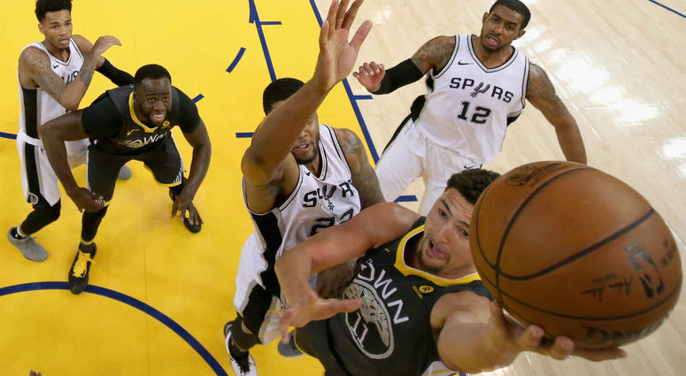 San Antonio Spurs v Golden State Warriors Klay Thompson #11 of the Golden State Warriors goes up for a shot against Rudy Gay #22 of the San Antonio Spurs during Game 2 of Round 1 of the 2018 NBA Playoffs at ORACLE Arena on April 16, 2018 in Oakland, California.