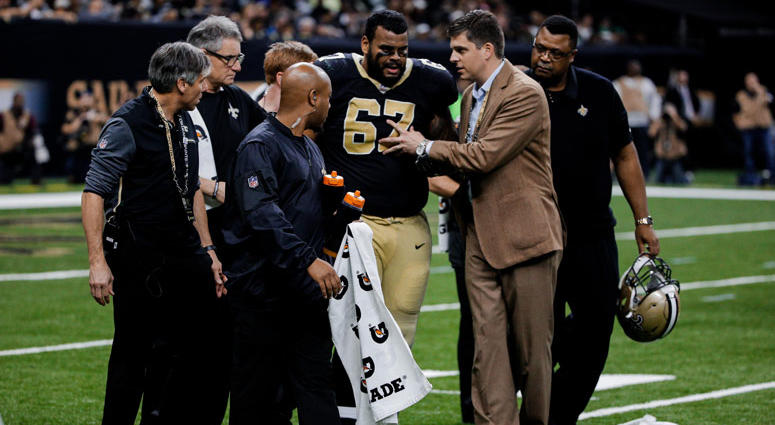 New Orleans Saints offensive guard Larry Warford (67) is helped off the field by trainers after suffering a concussion New Orleans Saints offensive guard Larry Warford (67) is helped off the field by trainers after suffering a concussion