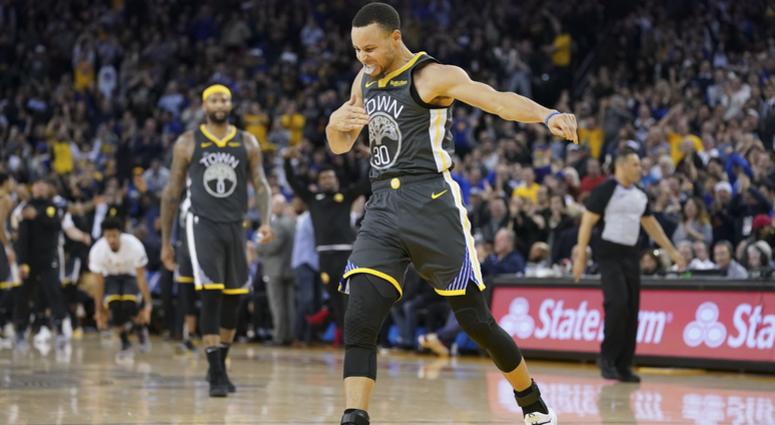 Golden State Warriors guard Stephen Curry (30) celebrates after making a three-point basket during the fourth quarter against the Utah Jazz