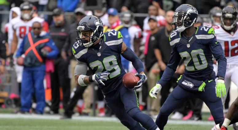 Oct 16, 2016; Seattle, WA, USA; Seattle Seahawks safety Earl Thomas (29) carries the ball on an interception return in the fourth quarter against the Atlanta Falcons during a NFL football game at CenturyLink Field. The Seahawks defeated the Falcons 26-24. Oct 16, 2016; Seattle, WA, USA; Seattle Seahawks safety Earl Thomas (29) carries the ball on an interception return in the fourth quarter against the Atlanta Falcons during a NFL football game at CenturyLink Field. The Seahawks defeated the Falcons 26-24.