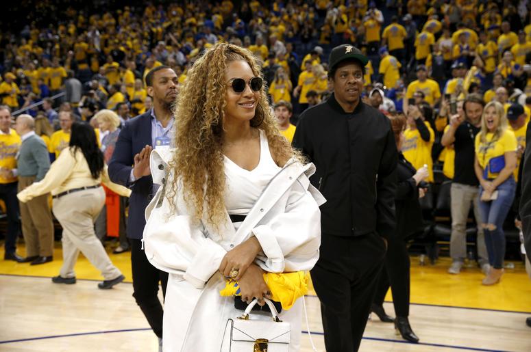 Apr 28, 2018; Oakland, CA, USA; American recording artists Beyonce and Jay-Z leave the court at the end of the Golden State Warriors and New Orleans Pelicans game, in game one of the second round of the 2018 NBA Playoffs at Oracle Arena. Mandatory Credit: