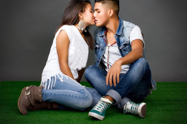 Couple kisses in a park