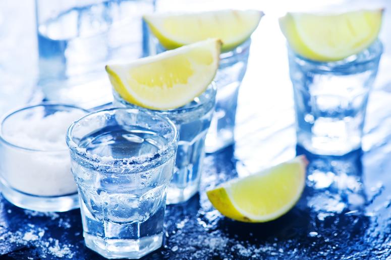 Tequilla with salt and lime on a table Tequilla with salt and lime on a table