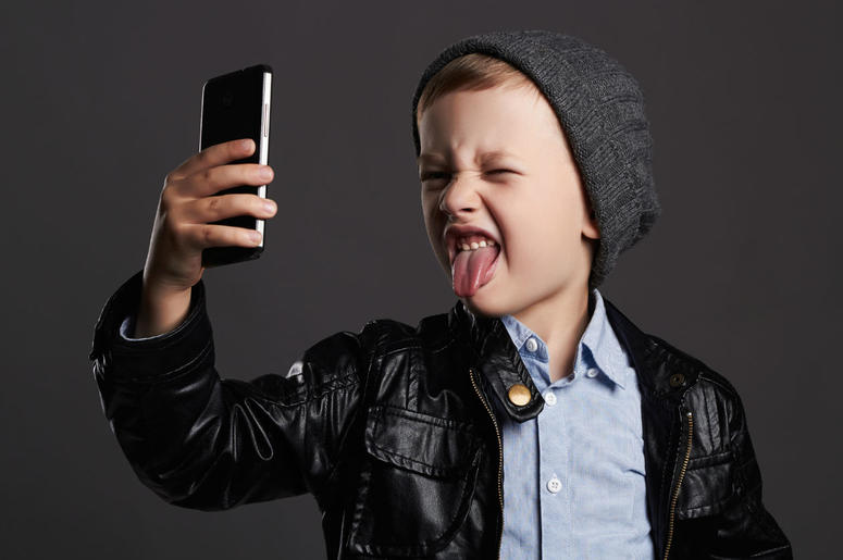 Kid with a phone Kid with a phone
