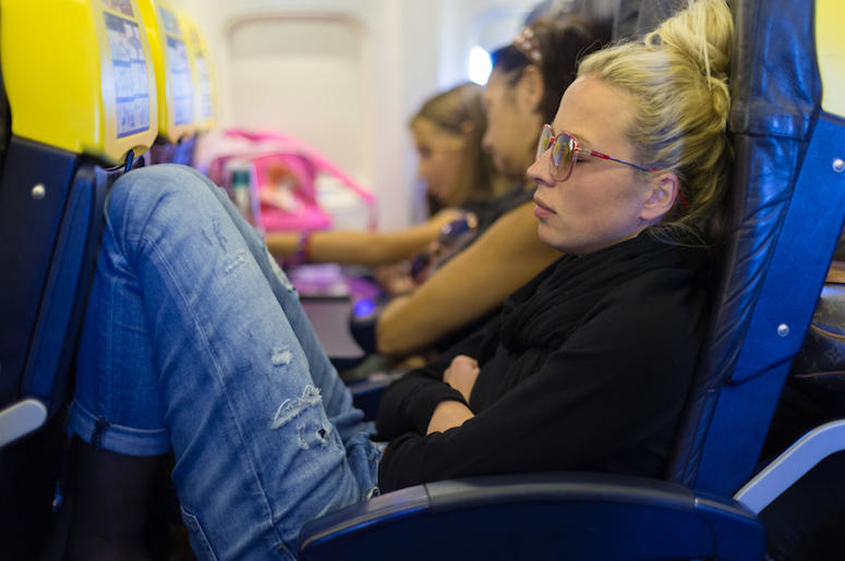 Woman, Napping, Plane, Legroom Woman, Napping, Plane, Legroom