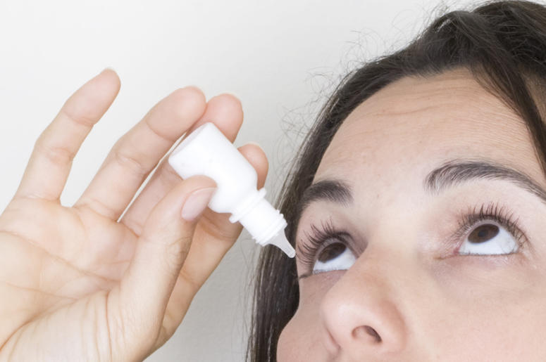 Young Woman, Eye Drops, White Background Young Woman, Eye Drops, White Background