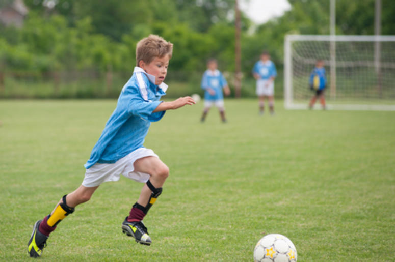 Kid Playing Soccer