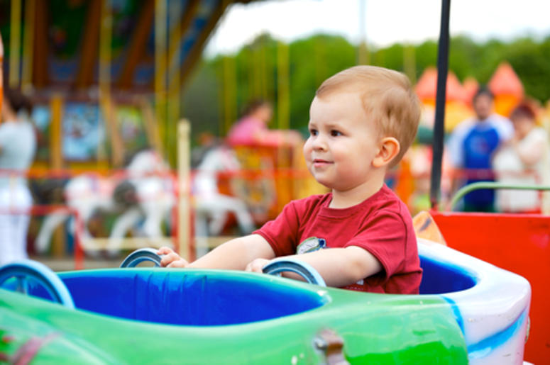 Child At An Amusement Park