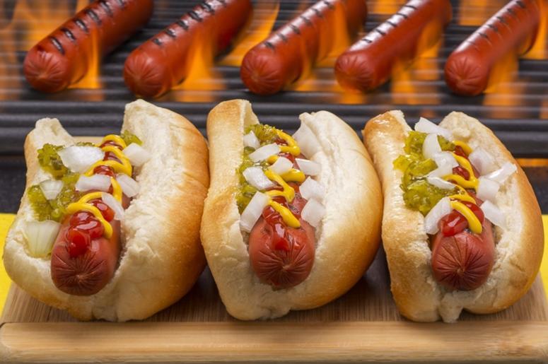 Hot Dogs Grilled in Buns Barbecue Grill Background Hot Dogs Grilled in Buns Barbecue Grill Background