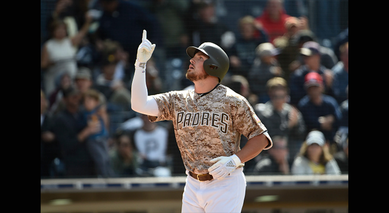 Hunter Renfroe #10 of the San Diego Padres points skyward after hitting a three-run home run in the seventh inning against the Pittsburgh Pirates at Petco Park May 19, 2019 in San Diego, California. (Photo by Denis Poroy/Getty Images)