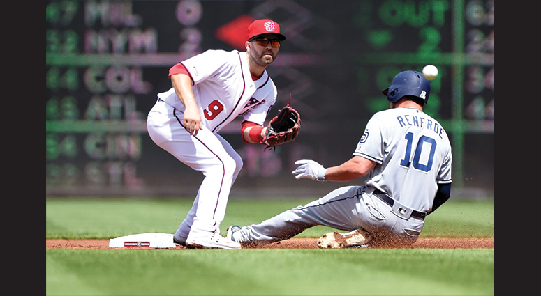 Hunter Renfroe #10 of the San Diego Padres steals second base ahead of the throw to Brian Dozier #9 of the Washington Nationals in the second inning at Nationals Park on April 28, 2019 in Washington, DC. (Photo by Greg Fiume/Getty Images)