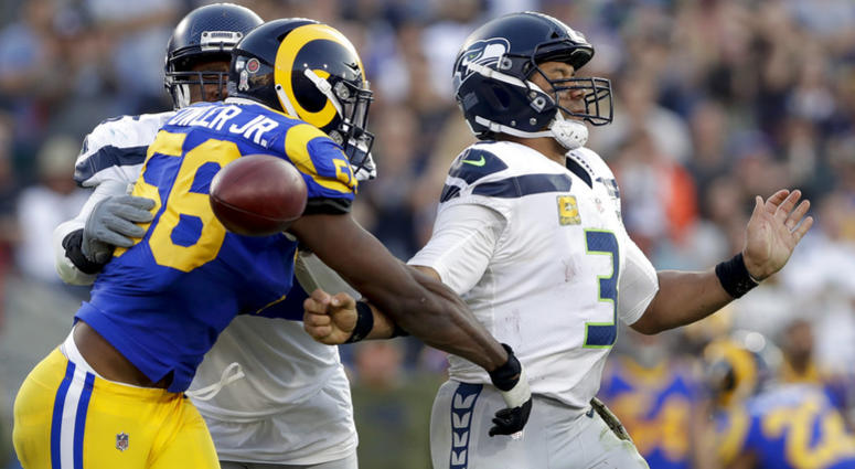 Los Angeles Rams defensive end Dante Fowler forces a fumble by Seattle Seahawks quarterback Russell Wilson during the second half in an NFL football game Sunday, Nov. 11, 2018, in Los Angeles Los Angeles Rams defensive end Dante Fowler forces a fumble by Seattle Seahawks quarterback Russell Wilson during the second half in an NFL football game Sunday, Nov. 11, 2018, in Los Angeles