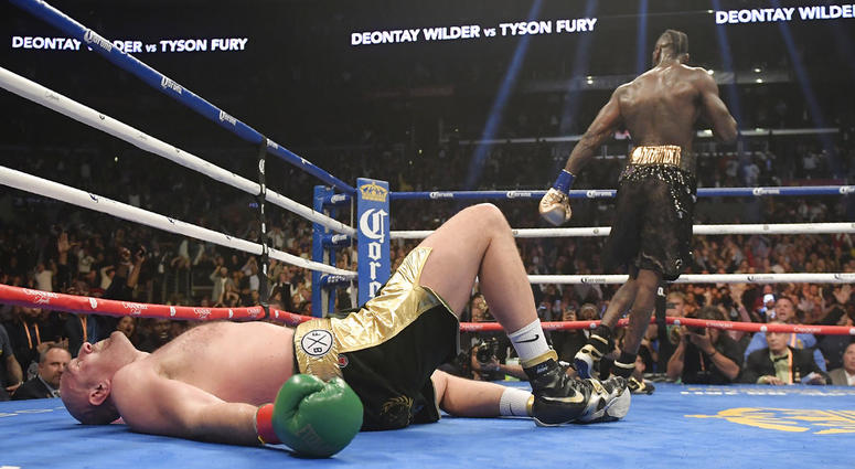 Tyson Fury, of England, lies on the canvas Tyson Fury, of England, lies on the canvas