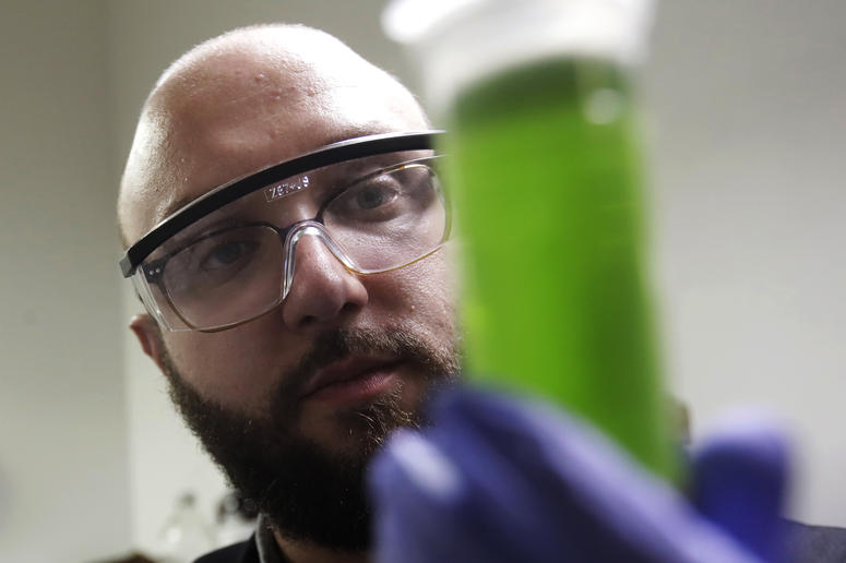 In this Friday, Aug. 16, 2019, photo, chemist David Dawson holds up a vial of extracted cannabis with an organic solvent as he demonstrates testing for THC and other chemicals at CW Analytical Laboratories in Oakland, Calif. In this Friday, Aug. 16, 2019, photo, chemist David Dawson holds up a vial of extracted cannabis with an organic solvent as he demonstrates testing for THC and other chemicals at CW Analytical Laboratories in Oakland, Calif.