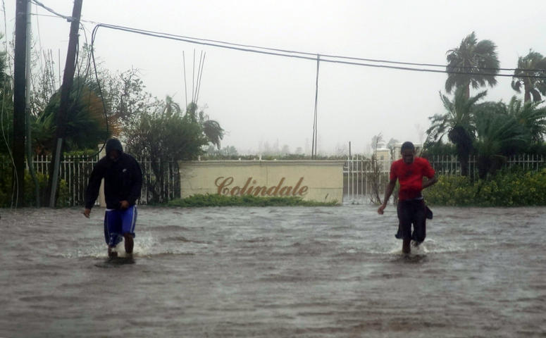 Residents wade through a street flooded with water brought on by Hurricane Dorian in Freeport, Bahamas, Tuesday, Sept. 3, 2019. Residents wade through a street flooded with water brought on by Hurricane Dorian in Freeport, Bahamas, Tuesday, Sept. 3, 2019.