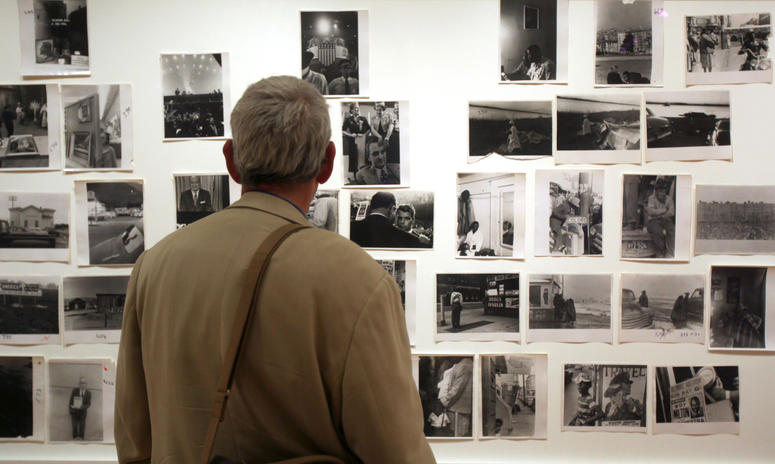 A man looks at prints from the Looking In: Robert Frank's "The Americans" exhibit at the Museum of Modern Art in San Francisco. A man looks at prints from the Looking In: Robert Frank's "The Americans" exhibit at the Museum of Modern Art in San Francisco.