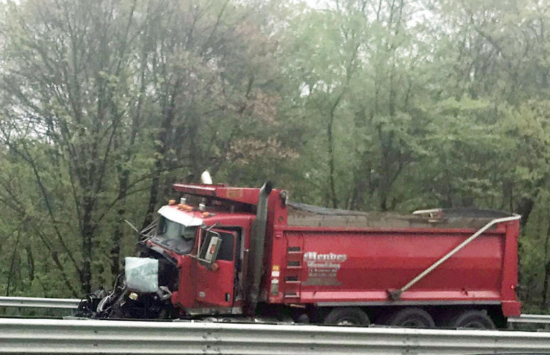 A dump truck sits near the scene after a collision with a school bus in Mount Olive, N.J. A dump truck sits near the scene after a collision with a school bus in Mount Olive, N.J.