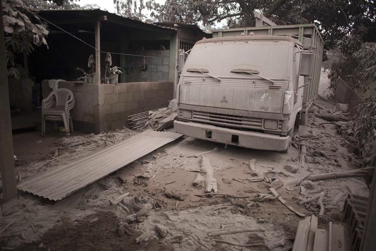 A truck is covered in volcanic ash spewed by Volcan de Fuego, or Volcano of Fire, in Escuintla, Guatemala. A truck is covered in volcanic ash spewed by Volcan de Fuego, or Volcano of Fire, in Escuintla, Guatemala.