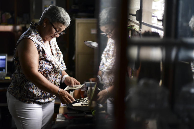 Nerybelle Perez goes through photographs of her father, World War II veteran Efrain Perez, who died inside an ambulance after being turned away from the largest public hospital when it had no electricity or water, days after Hurricane Maria passed. Nerybelle Perez goes through photographs of her father, World War II veteran Efrain Perez, who died inside an ambulance after being turned away from the largest public hospital when it had no electricity or water, days after Hurricane Maria passed.