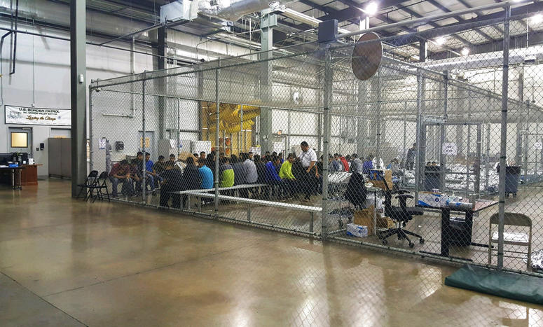 In this photo provided by U.S. Customs and Border Protection, people who've been taken into custody related to cases of illegal entry into the United States, sit in one of the cages at a facility in McAllen, Texas. In this photo provided by U.S. Customs and Border Protection, people who've been taken into custody related to cases of illegal entry into the United States, sit in one of the cages at a facility in McAllen, Texas.