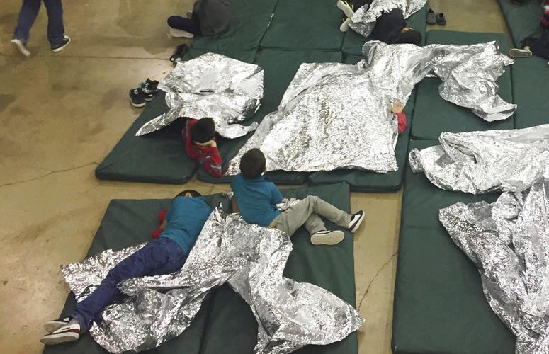 In this photo provided by U.S. Customs and Border Protection, people who've been taken into custody related to cases of illegal entry into the United States, rest in one of the cages at a facility in McAllen, Texas. In this photo provided by U.S. Customs and Border Protection, people who've been taken into custody related to cases of illegal entry into the United States, rest in one of the cages at a facility in McAllen, Texas.