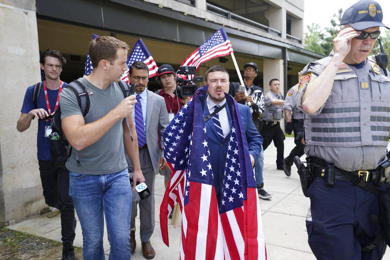 White nationalist Jason Kessler arrives at the Vienna metro station in Vienna, Va., Sunday, Aug. 12, 2018. White nationalist Jason Kessler arrives at the Vienna metro station in Vienna, Va., Sunday, Aug. 12, 2018.