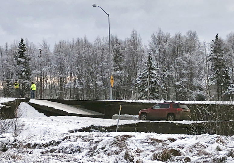 A car is trapped on a collapsed section of the offramp off of Minnesota Drive in Anchorage, Friday, Nov. 30, 2018. Alaska Quake