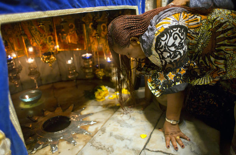 A Christian worshipper prays at the Grotto, under the Church of the Nativity, traditionally recognized by Christians to be the birthplace of Jesus Christ, in the West Bank city of Bethlehem, Sunday, Dec. 23, 2018. A Christian worshipper prays at the Grotto, under the Church of the Nativity, traditionally recognized by Christians to be the birthplace of Jesus Christ, in the West Bank city of Bethlehem, Sunday, Dec. 23, 2018.