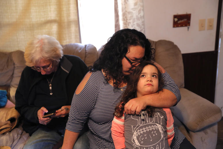 Tina Chastant hugs her daughter Rosalina Chastant, 5, in Gonzalez, La., Sunday, Jan. 27, 2019, after they arrived to comfort Kim Mincks, left, after two people were found dead inside the home yesterday. Tina Chastant hugs her daughter Rosalina Chastant, 5, in Gonzalez, La., Sunday, Jan. 27, 2019, after they arrived to comfort Kim Mincks, left, after two people were found dead inside the home yesterday.