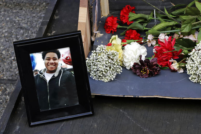 A photo of Antwon Rose II sits with a memorial display for Rose II in front of the Allegheny County courthouse on the second day of the trial for Michael Rosfeld, a former police officer in East Pittsburgh, Pa., Wednesday, March 20, 2019. Antwon Rose II