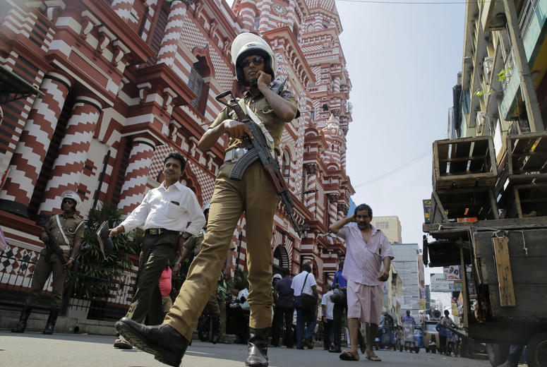 A Sri Lankan police officer patrols out side a mosque in Colombo, Sri Lanka, Wednesday, April 24, 2019. A Sri Lankan police officer.