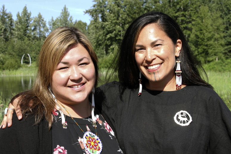 In this June 19, 2019, photo, Rochelle Adams, left, an Alaska Native cultural advisor, and Princess Johnson, the creative producer for the series "Molly of Denali" appear at the Alaska Native Heritage Center in Anchorage, Alaska. Molly of Denali