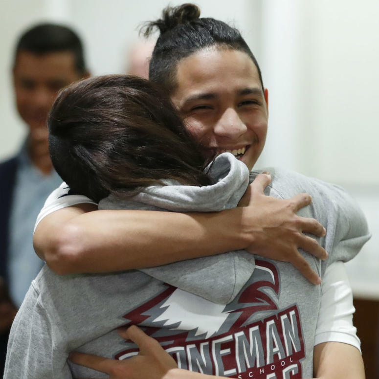 Anthony Borges, rear, who was shot during the Parkland, Fla., school shooting, hugs Marianne Sheehan after a news conference with Florida governor Ron DeSantis, Wednesday, Feb. 13, 2019, in Fort Lauderdale, Fla. Anthony Borges, rear, who was shot during the Parkland, Fla., school shooting, hugs Marianne Sheehan after a news conference with Florida governor Ron DeSantis, Wednesday, Feb. 13, 2019, in Fort Lauderdale, Fla.