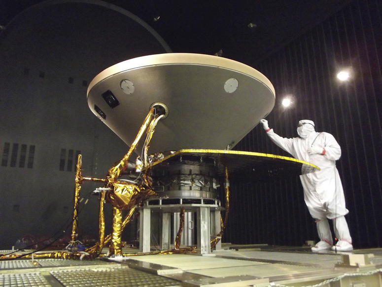 In this 2015 photo made available by NASA, a technician prepares the InSight spacecraft for thermal vacuum testing in its "cruise" configuration for its flight to Mars, simulating the conditions of outer space at Lockheed Martin Space Systems in Denver. In this 2015 photo made available by NASA, a technician prepares the InSight spacecraft for thermal vacuum testing in its "cruise" configuration for its flight to Mars, simulating the conditions of outer space at Lockheed Martin Space Systems in Denver.