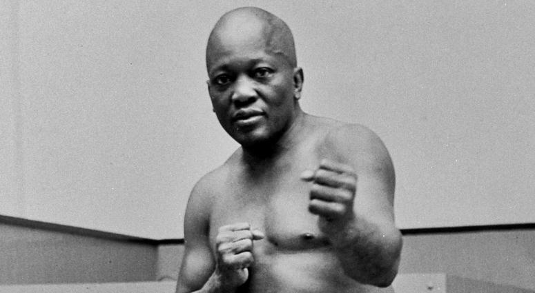 In this 1932 file photo, boxer Jack Johnson, the first black world heavyweight champion, poses in New York City. In this 1932 file photo, boxer Jack Johnson, the first black world heavyweight champion, poses in New York City.
