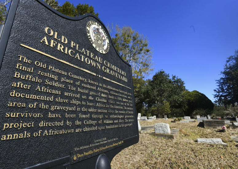Old Plateau Cemetery, the final resting place for many who spent their lives in Africatown, stands in need of upkeep near Mobile, Ala., on Tuesday, Jan. 29, 2019. Many of the survivors of the Clotilda's voyage are buried here amongst the trees. Old Plateau Cemetery, the final resting place for many who spent their lives in Africatown, stands in need of upkeep near Mobile, Ala., on Tuesday, Jan. 29, 2019. Many of the survivors of the Clotilda's voyage are buried here amongst the trees.
