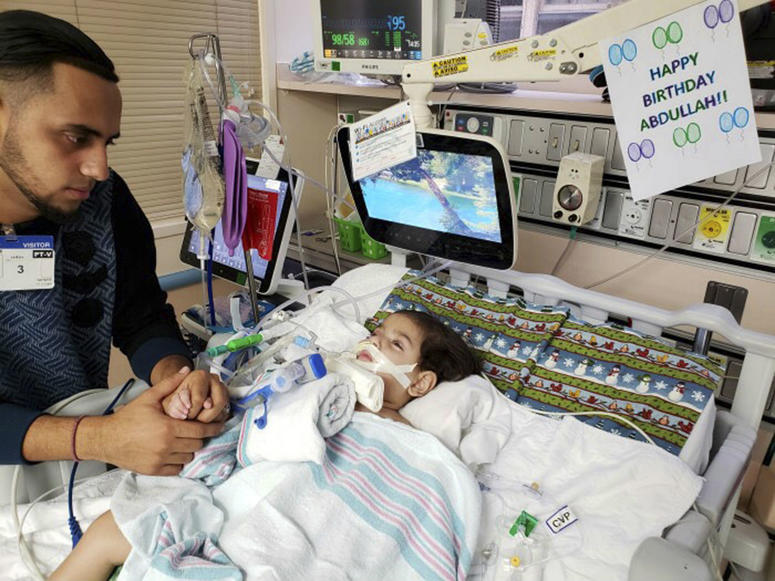 Ali Hassan is shown with his dying 2-year-old son Abdullah in a Sacramento hospital. Ali Hassan is shown with his dying 2-year-old son Abdullah in a Sacramento hospital.