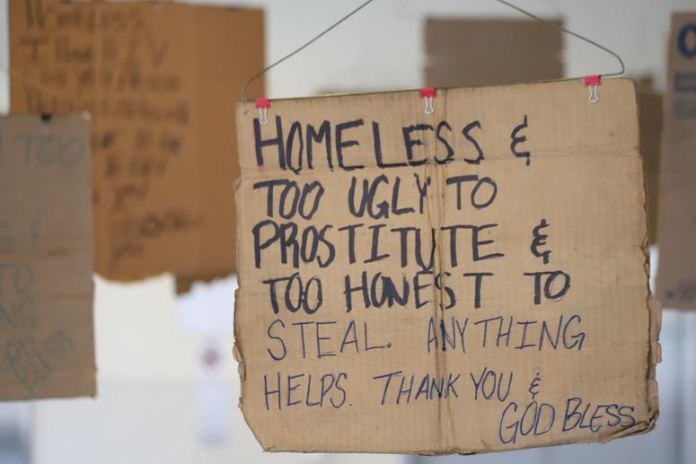 Willie Baronet, an artist and professor, purchased signs from the homeless people that they used to pander for money and turned them into a hanging art instillation. Willie Baronet, an artist and professor, purchased signs from the homeless people that they used to pander for money and turned them into a hanging art instillation.