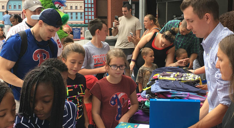 Youngsters from military families across the region line up to receive backpacks and school supplies during a special giveaway at Citzen's Bank Park on Tuesday. Youngsters from military families across the region line up to receive backpacks and school supplies during a special giveaway at Citzen's Bank Park on Tuesday.