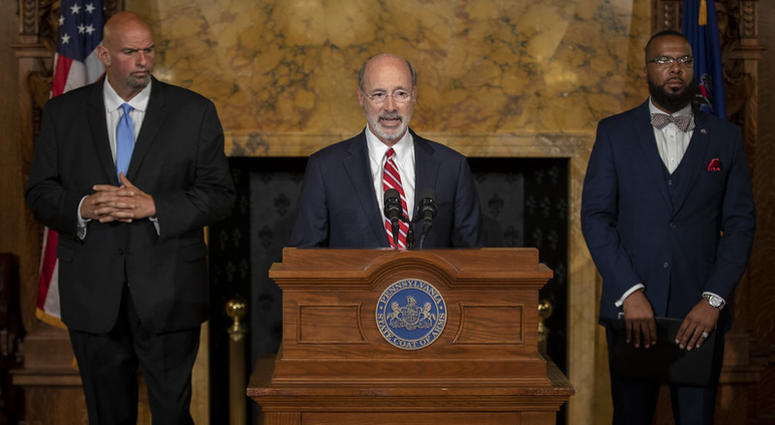Lt. Gov. John Fetterman (L), Gov. Tom Wolf (C) and Board of Pardons Secretary Brandon Flood (R). Gov. Wolf, Lt. Gov, Pardons Board Provide Update on Pardons Process, Benefit to Those with Marijuana Convictions.