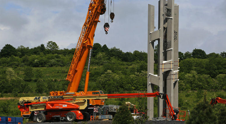 This May 31, 2018, photo shows the first section of the 93-foot tall Tower of Voices wind chimes is in place at the Flight 93 National Memorial in Shanksville, Pa. first section of the 93-foot tall Tower of Voices wind chimes is in place at the Flight 93 National Memorial in Shanksville, Pa.