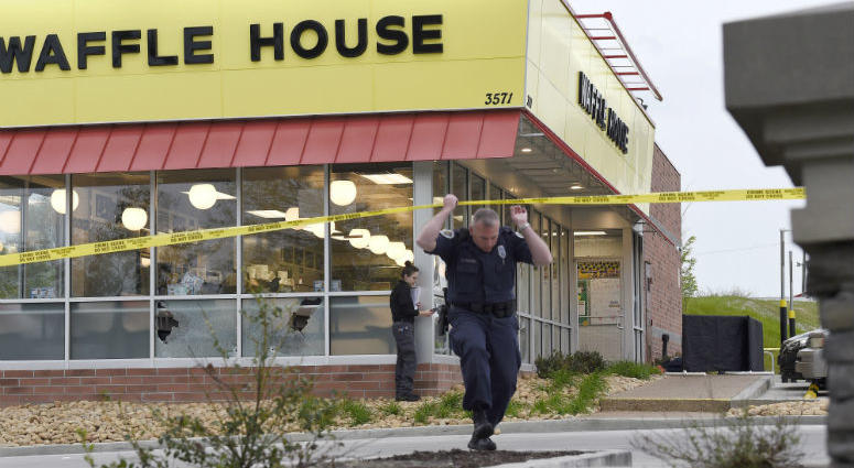 Law enforcement officials work the scene of a fatal shooting at a Waffle House in the Antioch neighborhood of Nashville, Sunday, April 22, 2018. Waffle House Shooting