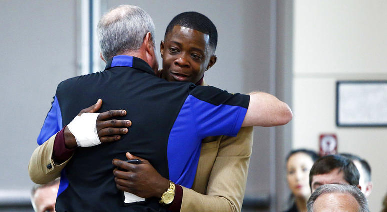 James Shaw, right, gets a hug from Waffle House CEO Walt Ehmer during a press conference on the Waffle House shooting Sunday, April 22, 2018 in Nashville, Tenn. Shaw wrestled the gun from the suspect. James Shaw / Waffle House Shooting Hero