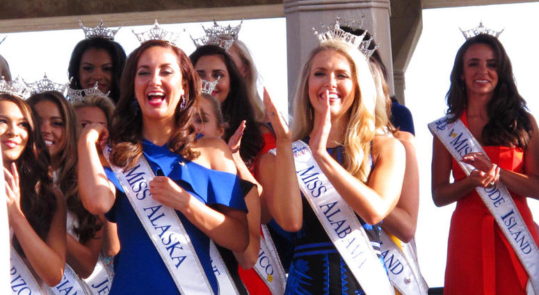 In this Aug. 30, 2017 photo, contestants attend a welcoming ceremony for the Miss America competition on the Atlantic City, N.J. Boardwalk. Miss America